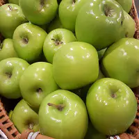Basket of sweet apples, granny smith to be use for apple barbecued pork recipe