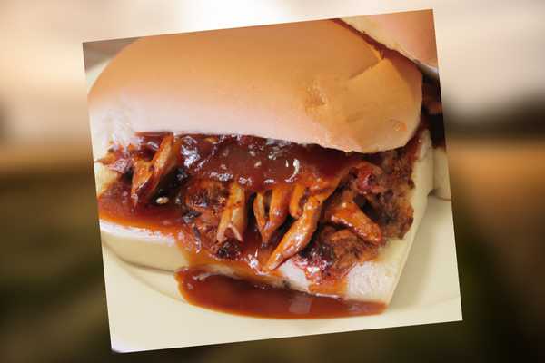 Best Eastern North Carolina BBQ Sauce Recipe on a bun with pulled pork