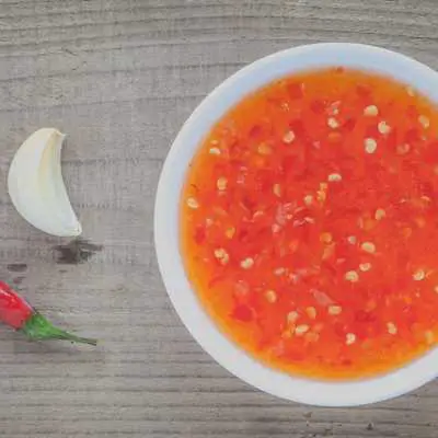 Simple Sweet Thai Chili Sauce Recipe is the perfect dipping sauce for coconut shrimp, spread over grilled salmon and served with raw veggie tray